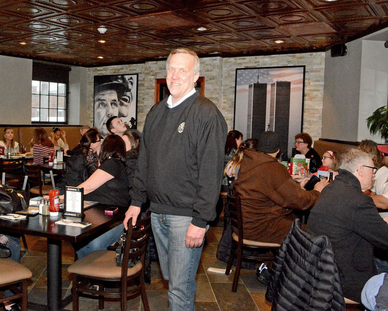 Robert F. Sullivan, owner of R.F. O’Sullivan’s in Lynn, stands among the opening day crowd Saturday.
