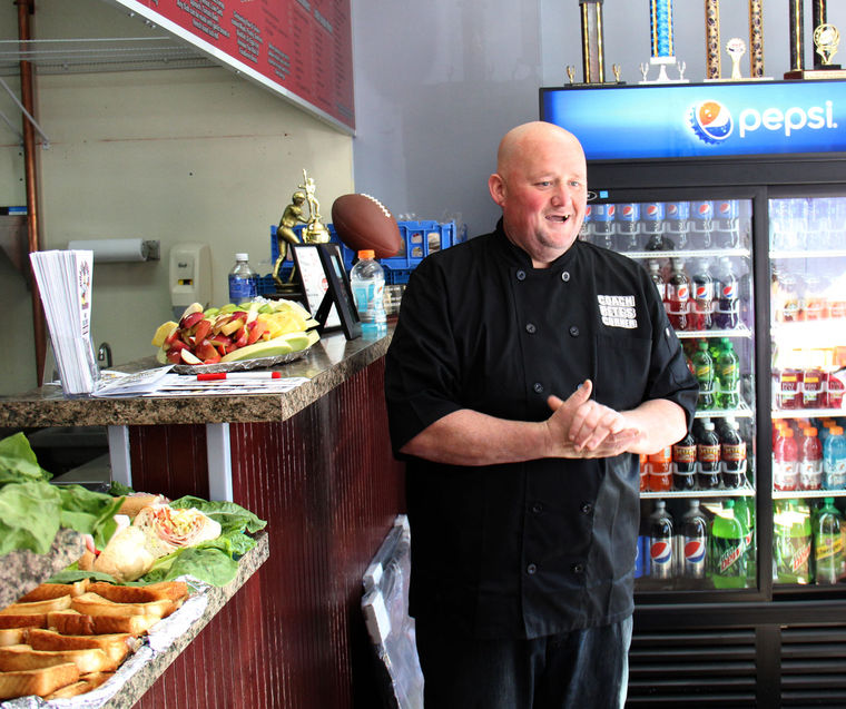 Lynn youth sports coach Petey Dow stands in his new restaurant, Coach Pete’s Corner, at 453 Chatham St.