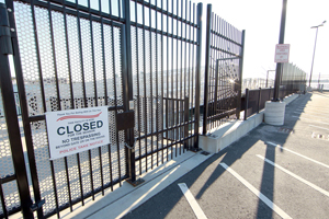 Image of fence blocking the ramp to where the ferry would dock.