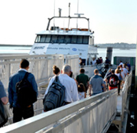 Passengers walking the boat ramp towards the Lynn/Boston Ferry