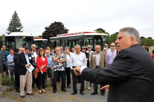 Charlie Patsios talks about the future of the land that used to house the old General Electric gear plant site during the economic development tour today.