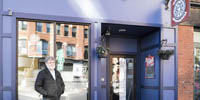 Yakov Tseitlin, owner of the White Rose Coffeehouse space, stands in front of the shuttered cafe.